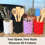 Four colorful silicone containers with kitchen utensils and makeup on a countertop.