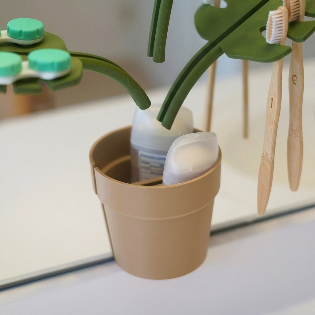 Bamboo toothbrushes and dental floss in a beige cup with green holders on a white surface.