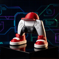 Gaming controller with red and white shoes on a reflective surface against a futuristic background
