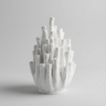 White Coral Vase with clustered tubular openings on a gray background