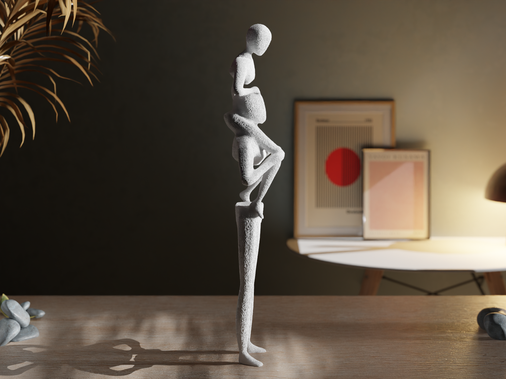 side of Abstract sculpture on a wooden table with a dark wall and framed pictures in the background