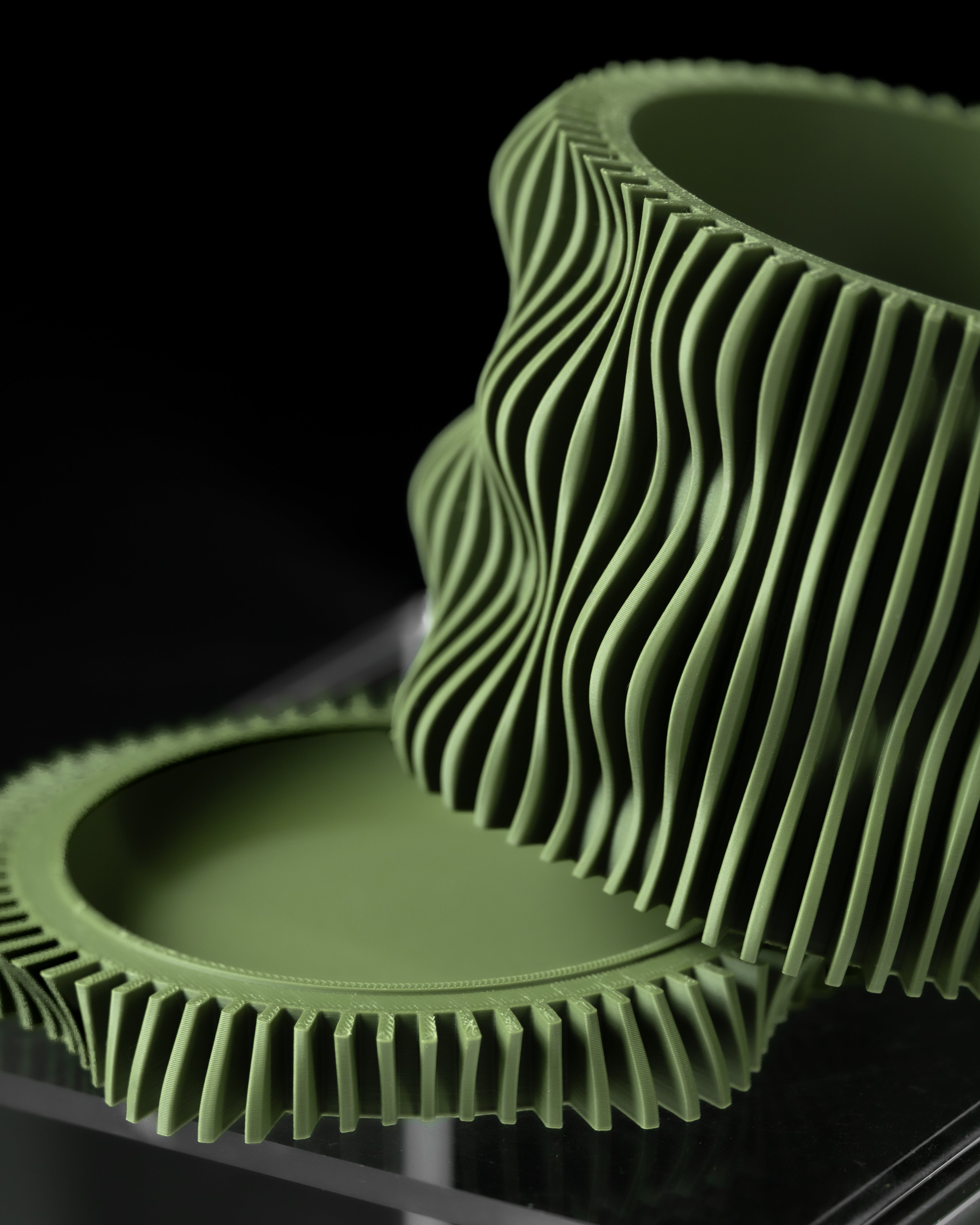 Olive Green planter and tray with wavy texture on a black background