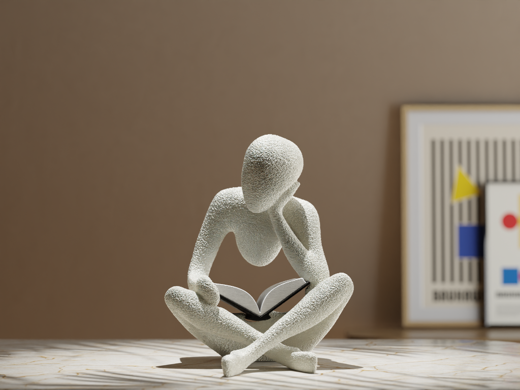 Modern minimalist reading sculpture for book lovers displayed on marble tabletop