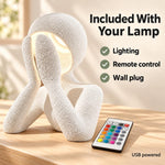 White NObody Lamp and remote showing included lighting, remote control and wall plug