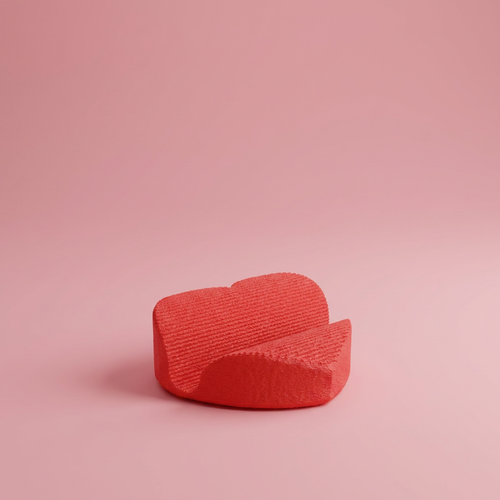 Red textured object on a pink background