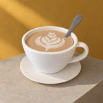 Large white cup-shaped storage container with latte-art lid and spoon