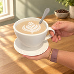 Large white coffee cup container held by its handle