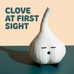 White garlic lamp on a teal and peach graphic