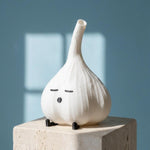 White garlic lamp on a light stone pedestal
