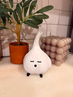 White garlic lamp on a kitchen counter with a white USB cable