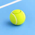 Neon yellow-green tennis ball clicker with a circular top button