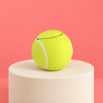 Close-up of the circular button and textured tennis ball clicker