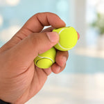 Two tennis ball clickers held together