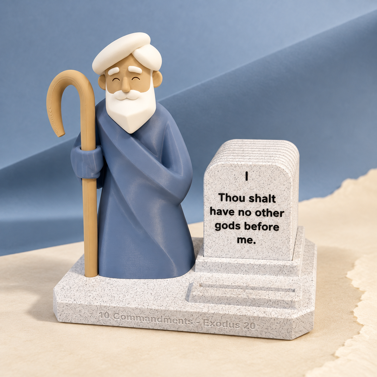 Moses Ten Commandments display against folded blue paper