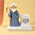 Moses display with swappable tablets against a warm paper backdrop