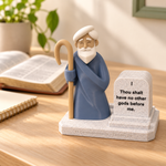 Moses display beside an open Bible and study notebook