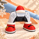 Santa controller stand holding a game controller in red Santa boots with yellow buckles, topped with a Santa hat on a snowy backdrop, gaming desk decor and christmas gamer gift. Controller not included.